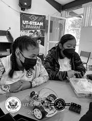 May be an image of 3 people, people sitting, indoor and text that says 'UT-STEAM BRIGADE STATES CONSULATE GENERAL UT-STEAM 1996 1996 amy MATAMOROS 2021 Anos 20'